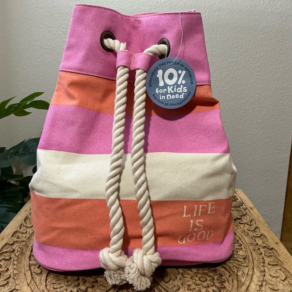 Life Is Good dockside sling bag in sunkissed orange